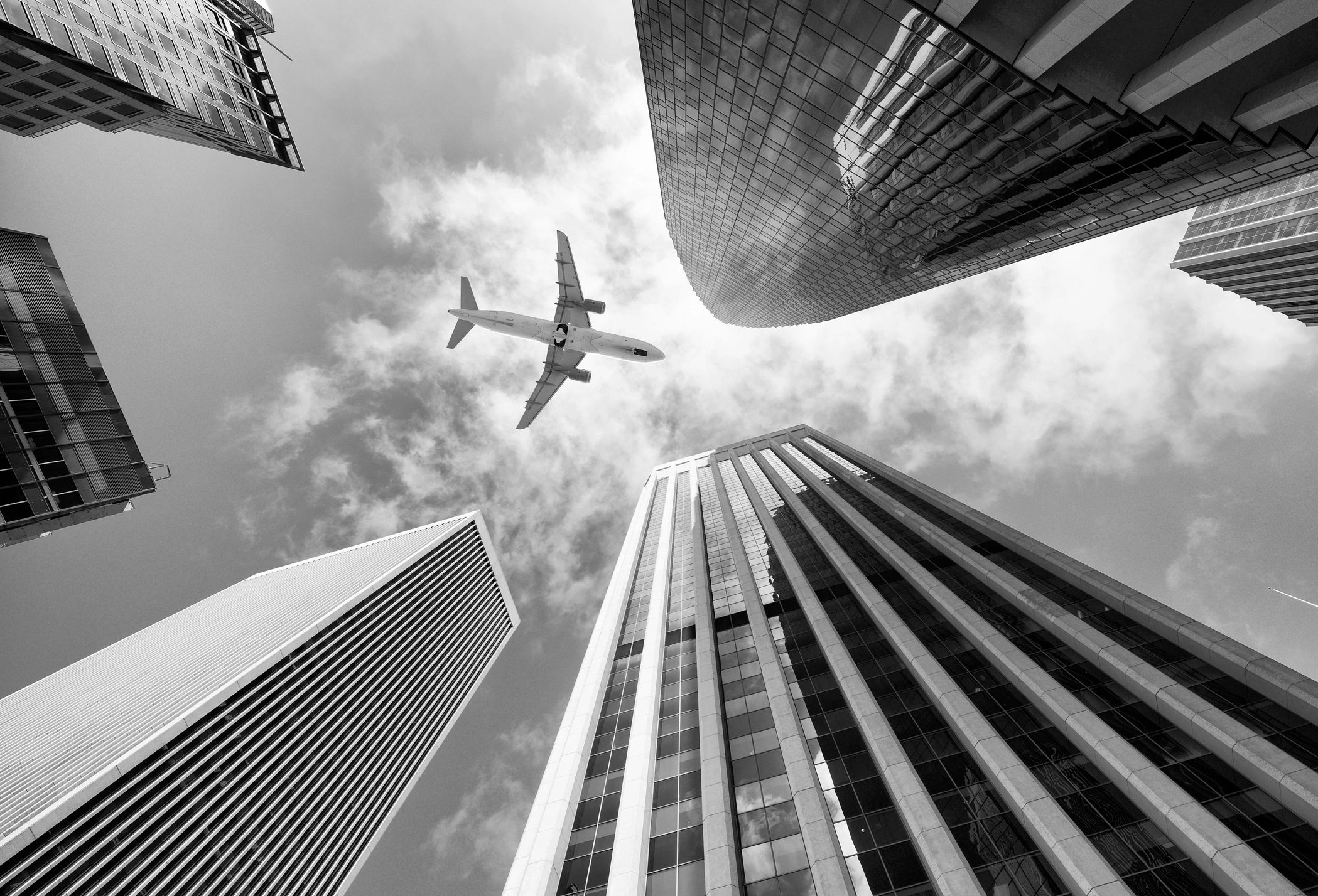 Aircraft concept above a city skyline