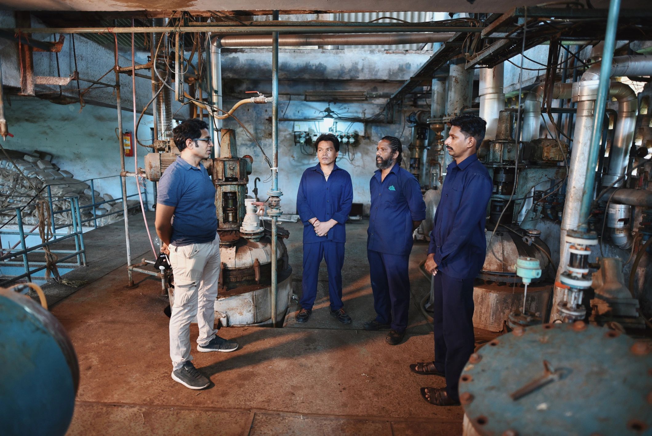 Engineering team collaborating in a manufacturing facility